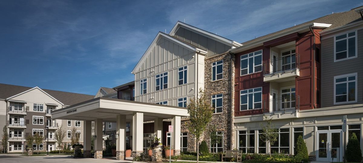 Wide angle exterior shot of an Avery Point resident and community building.