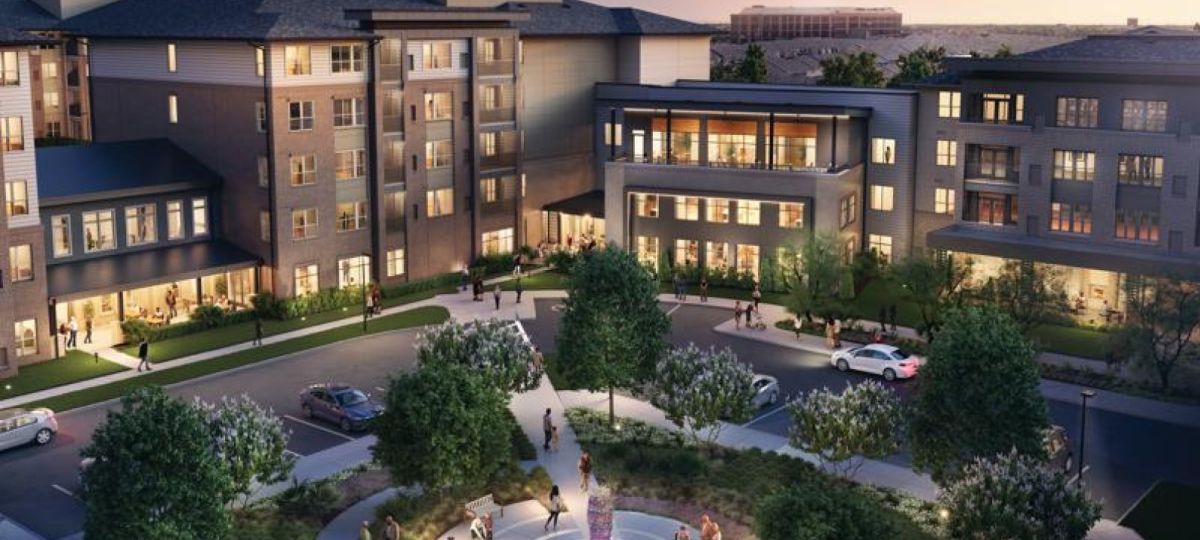 Dusk rendering of a modern apartment community with landscaped courtyard, central fountain, walking paths, and residents gathering outside illuminated buildings.