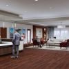 Interior rendering of an Erickson Senior Living community clubhouse lobby with reception desk, seating area, artwork, and large windows.